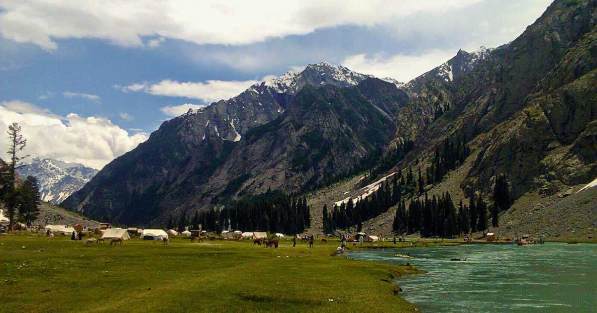 Kalam Valley with wide fields local animals in it and crystal-clear river nearby