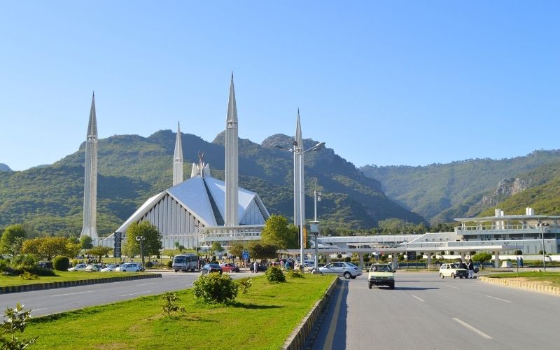 Faisal Mosque, blue sky and mountains Islamabad Pakistan